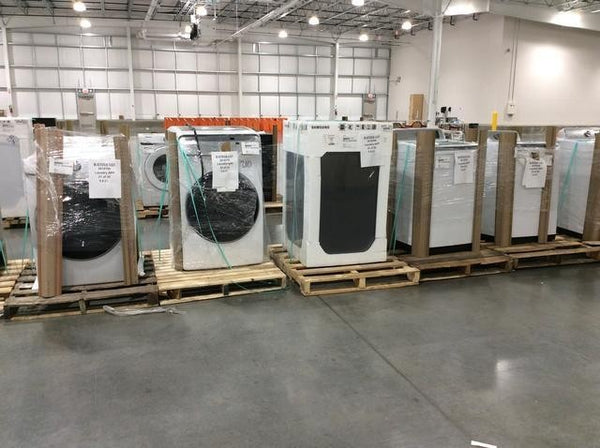 Pictured are laundry centers and a front load dryer from Costco scratch and dent program.