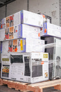 Stack of Vissani microwave oven boxes on a pallet in a warehouse setting