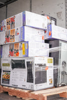 Stack of Vissani microwave oven boxes on a pallet in a warehouse setting