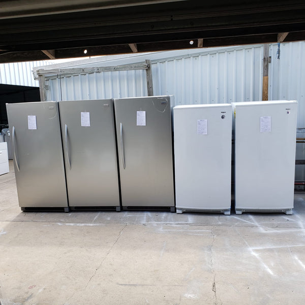 Pictured are scratch and dent stand up freezers from our liquidation programs.