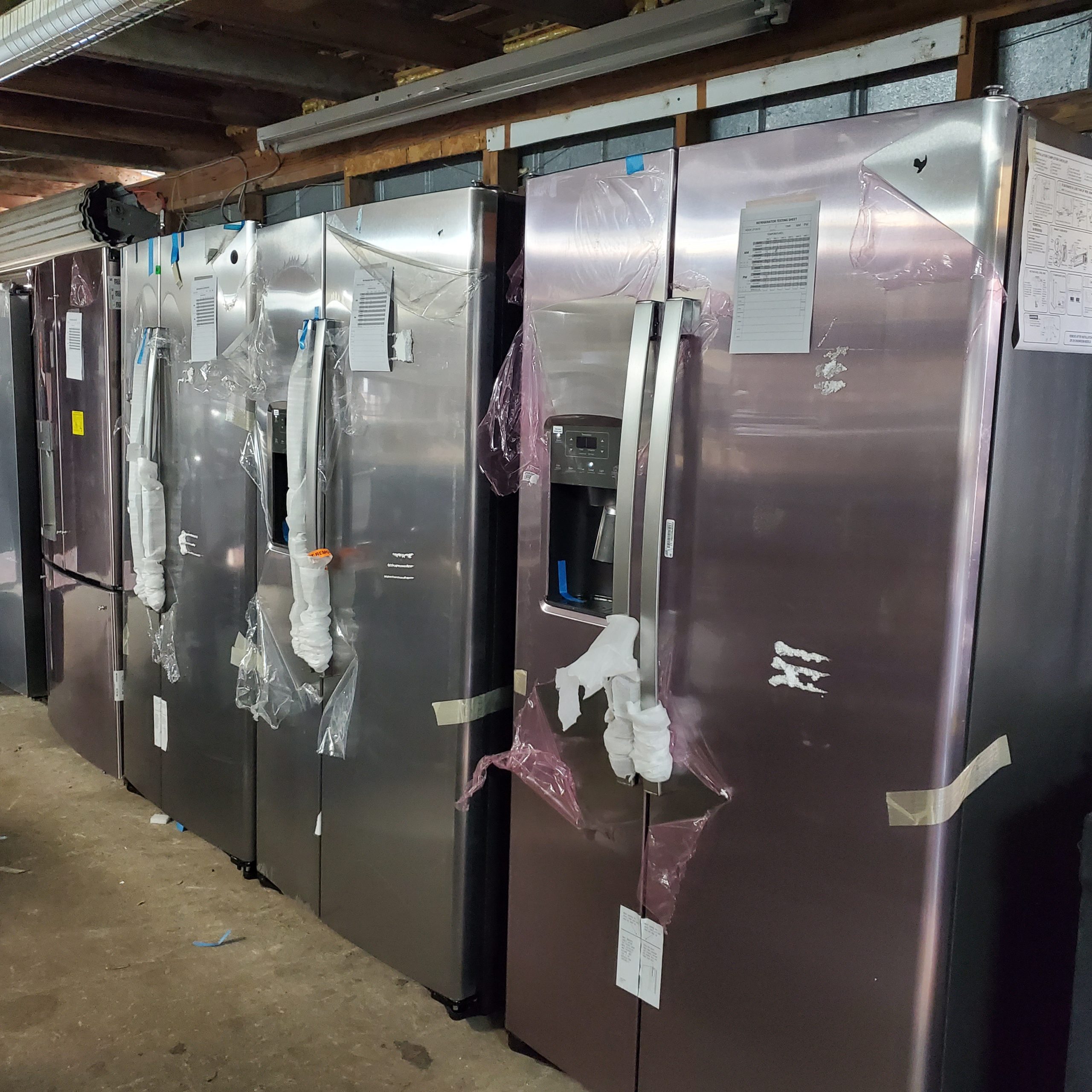example of GE stainless steel scratch and dent refrigerators available by the truckload.