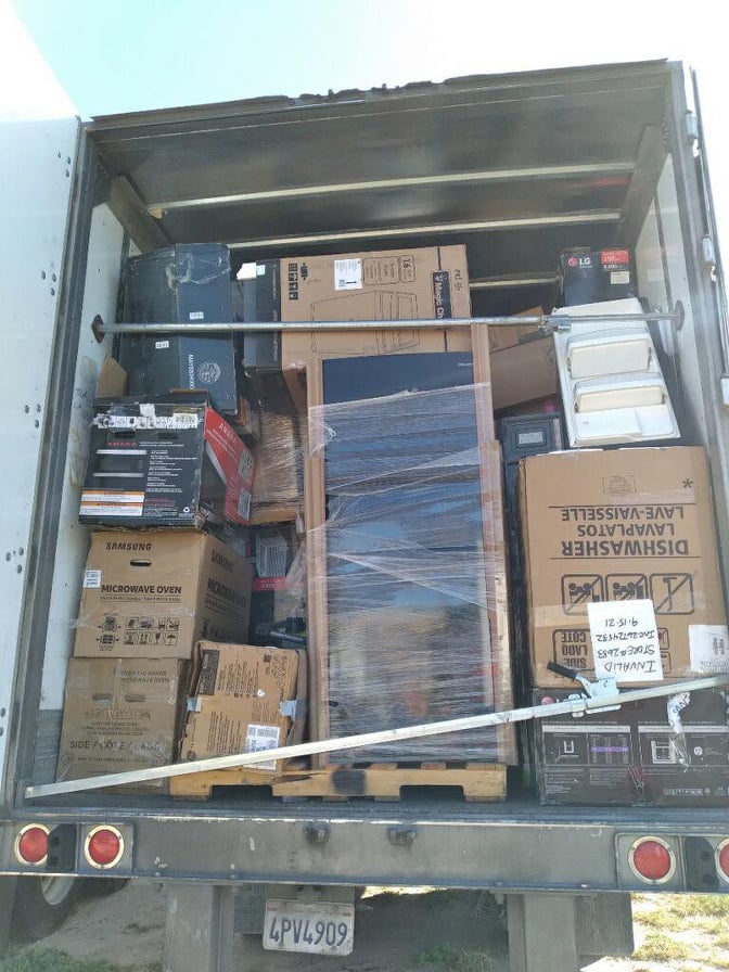 pictures of Another truckload order of unprocessed and untested Home Depot customer return appliances.