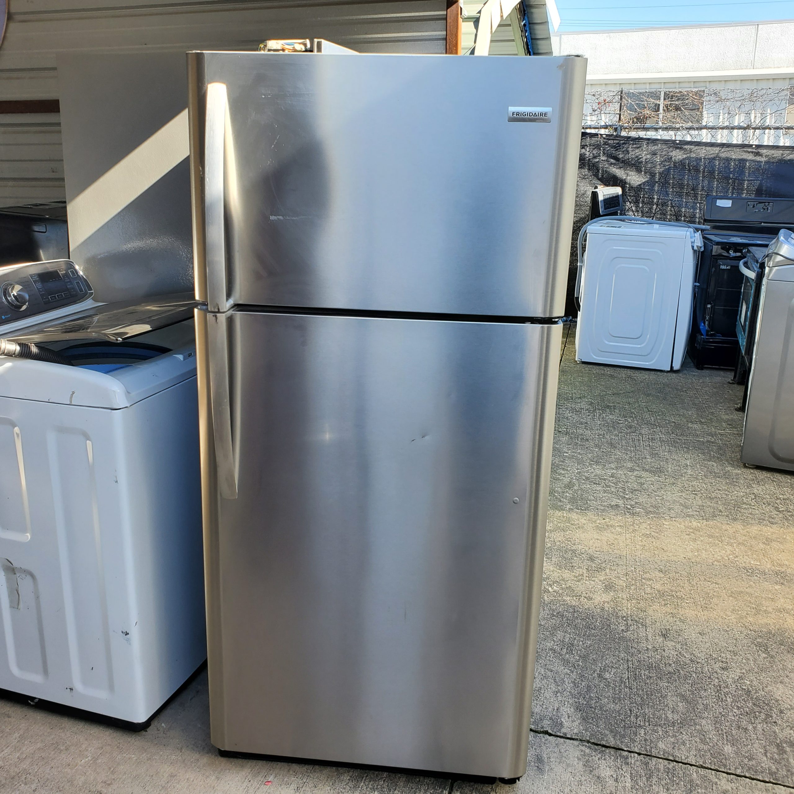 example picture of A Frigidaire stainless steel top and bottom refrigerator in our Salvage appliance program.