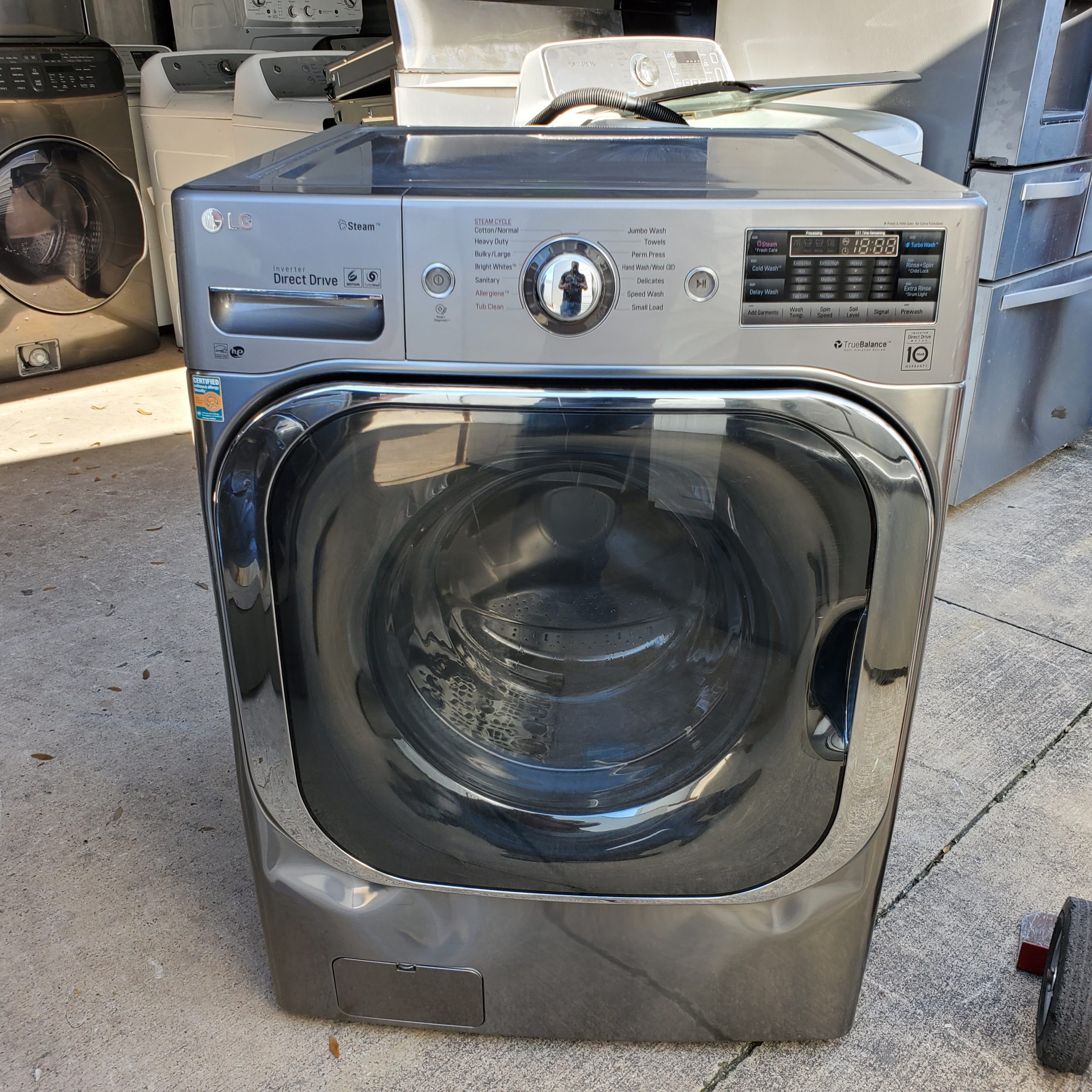example of A broken LG Washing machine from our salvage appliance truckload program.