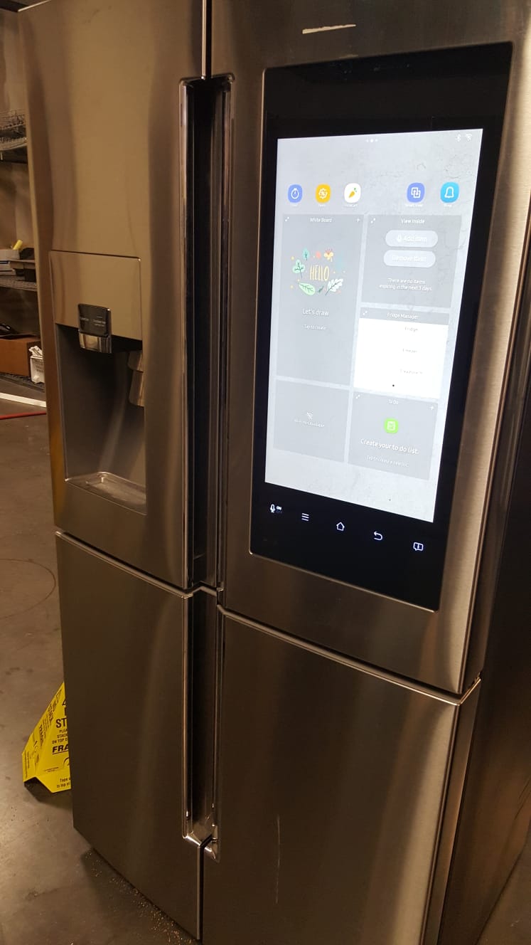 example pictures of A high end Samsung family hub refrigerators from a wholesale truckload lot recently sold.